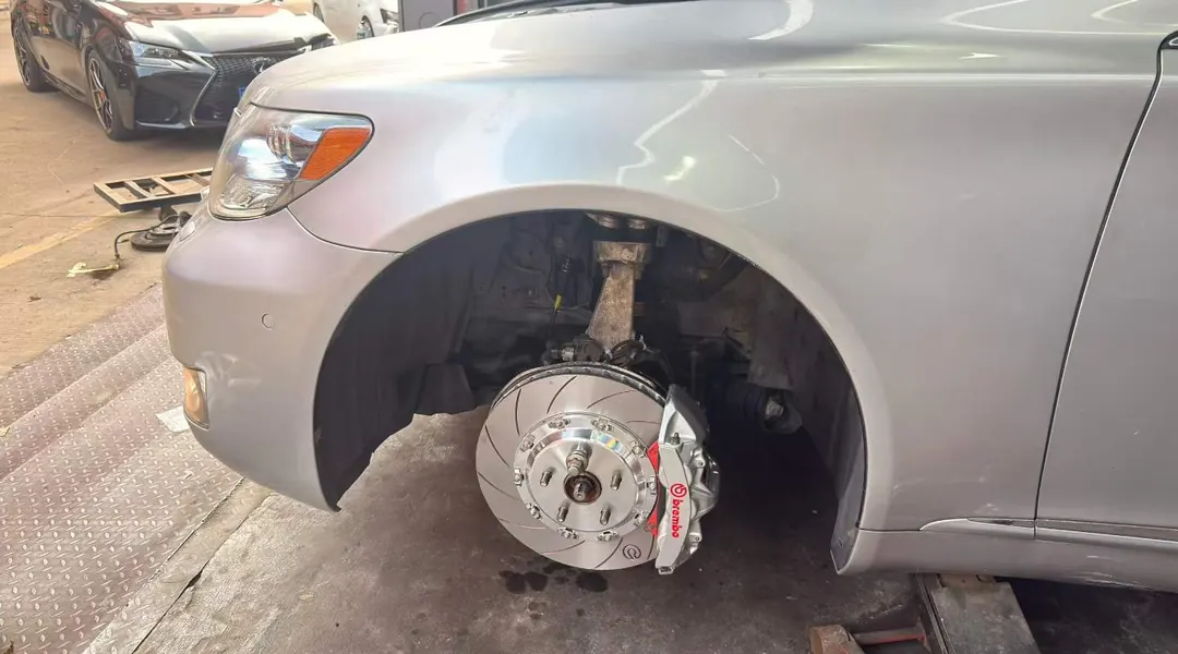 Wheel-off view of a brake kit during installation on a customer vehicle