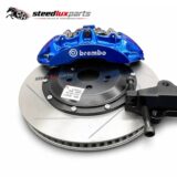 Toyota Corolla Cross front brake caliper kit components on a white background
