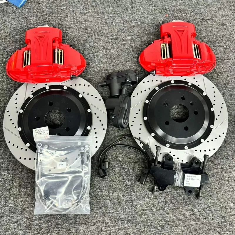 EPB rear brake caliper with integrated electric parking brake motor and electrical connector mounted against a brake disc.