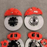 BMW X1 F49 Akebono 10N front brake kit 412/420 mm — Akebono 10N front caliper and drilled rotor shown behind an alloy wheel for BMW X1 F49 clearance review