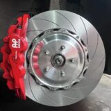 Wheel and caliper clearance inspection for a BMW F10 front brake kit with rotor and bracket fitment review