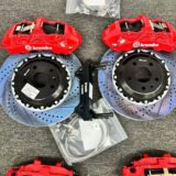 Close view of a GT6 front brake caliper, adapter bracket and ventilated rotor for BMW F34 fitment review.
