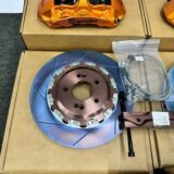 Close detail of a GT6 front six-piston caliper and ventilated brake rotor for BMW G30 fitment review