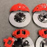 BMW X1 F49 Akebono 10N front brake kit 412/420 mm — Akebono 10N front caliper and drilled rotor shown behind an alloy wheel for BMW X1 F49 clearance review