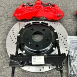 Close view of a GT6 front brake caliper, adapter bracket and ventilated rotor for BMW F34 fitment review.