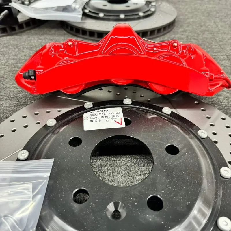 BMW F34 GT6 brake calipers and rotors arranged for front kit configuration review