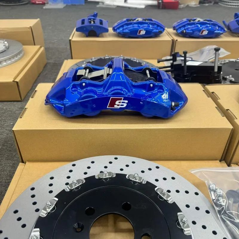 BMW G20 brake calipers and rotors arranged for front kit configuration review