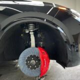 Akebono 10N front caliper and drilled rotor shown behind an alloy wheel for BMW X1 F49 clearance review