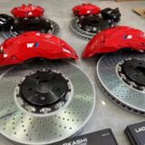Akebono 10N front caliper and drilled rotor shown behind an alloy wheel for BMW X1 F49 clearance review